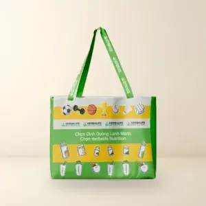 Túi vải đeo vai Herbalife ECO Shopping màu xanh lá, vàng và trắng in họa tiết thể thao dinh dưỡng