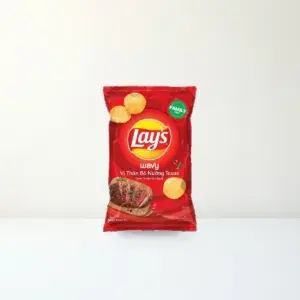 Bao bì mặt trước Snack Khoai Tây Lay's Wavy Vị Thăn Bò Nướng Texas Gói 150 g chính hãng Lay's