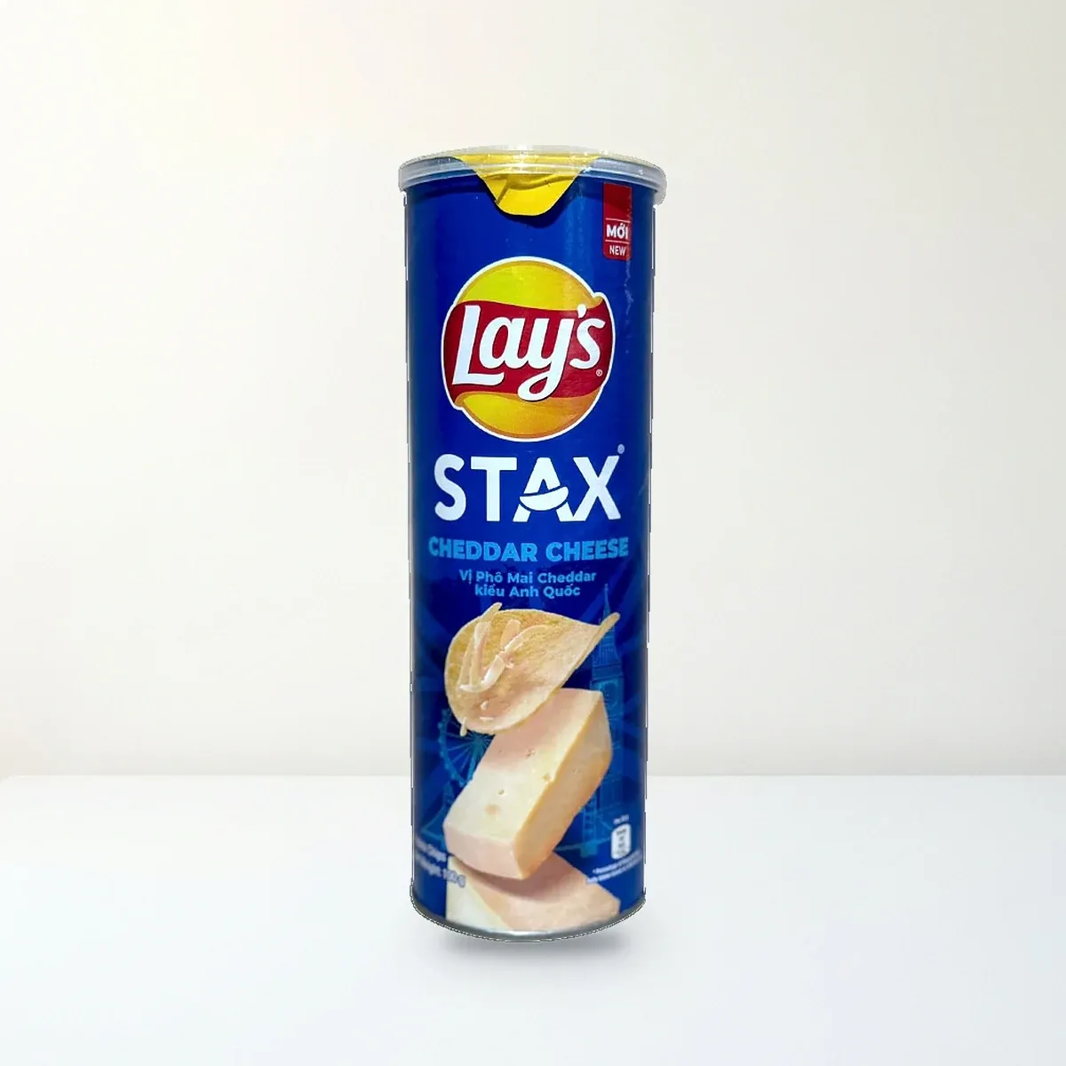 Bao bì mặt trước Snack Khoai Tây Miếng Lay's Stax Vị Phô Mai Cheddar Kiểu Anh Quốc Lon 100 g chính hãng Lay's Bao bì mặt trước Snack Khoai Tây Miếng Lay's Stax Vị Phô Mai Cheddar Kiểu Anh Quốc Lon 100 g chính hãng Lay's